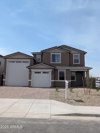 a front view of a house with garage
