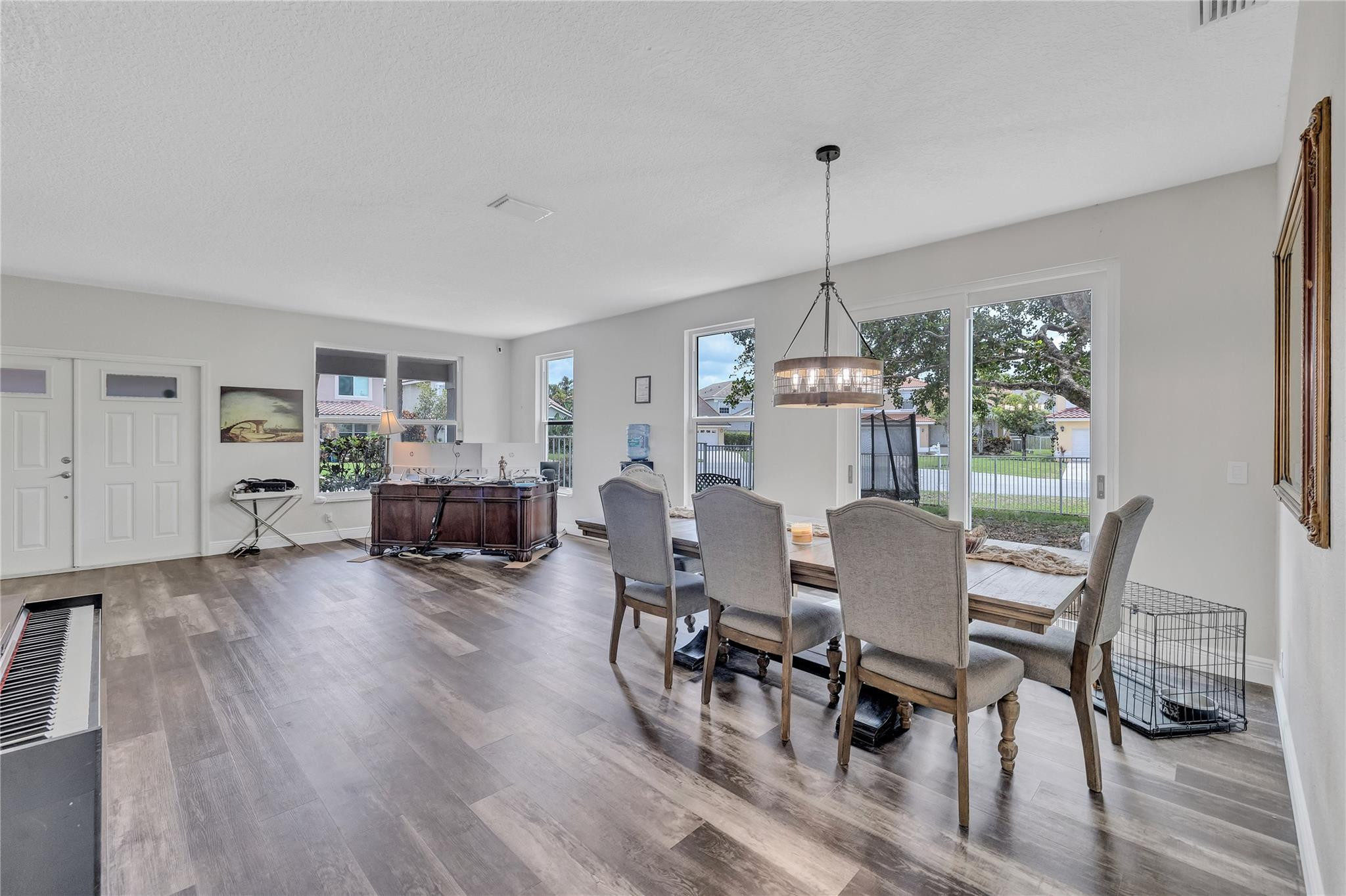 18219 Blue Lake Way Boca Raton, FL 33498 - Photo 16 of 39 a view of a dining room with furniture window and wooden floor