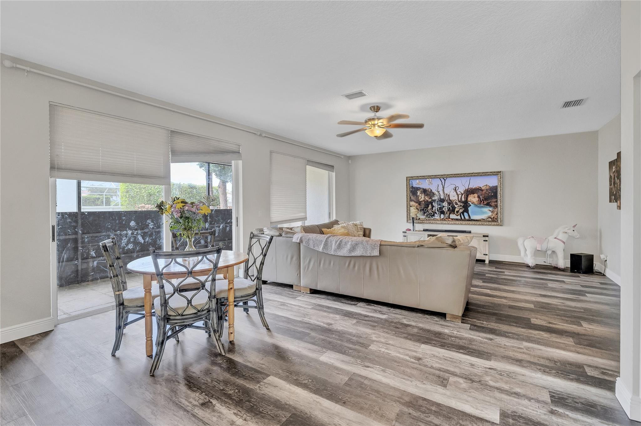 18219 Blue Lake Way Boca Raton, FL 33498 - Photo 17 of 39 a living room with furniture and a wooden floor