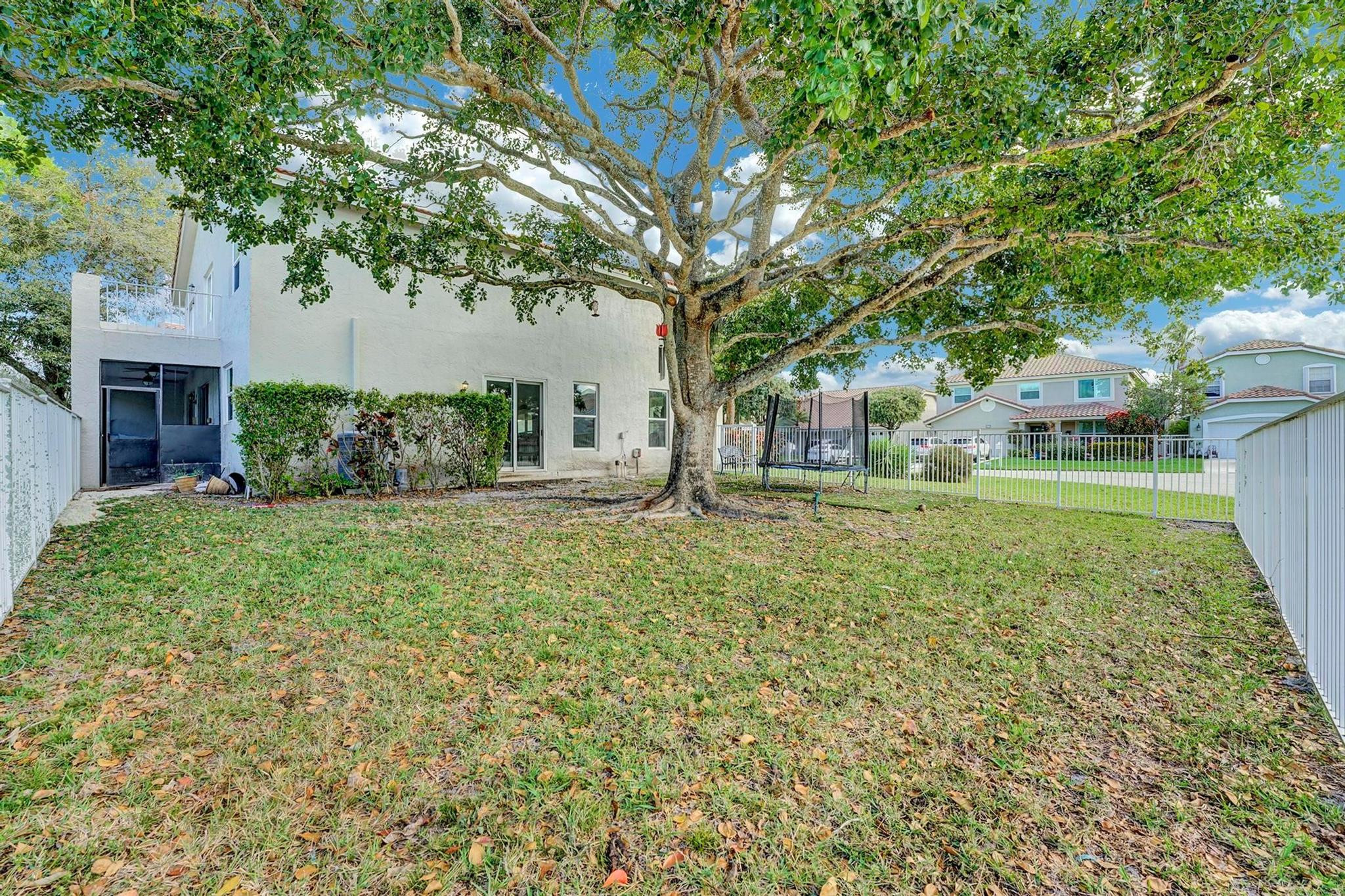 18219 Blue Lake Way Boca Raton, FL 33498 - Photo 39 of 39 a view of a house with a backyard
