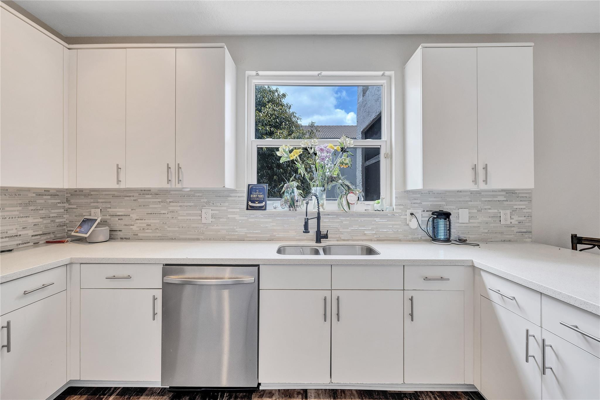 18219 Blue Lake Way Boca Raton, FL 33498 - Photo 7 of 39 a kitchen with white cabinets and sink