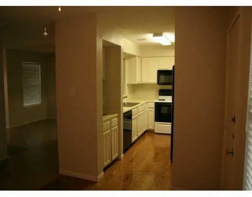 a bathroom with a shower and a glass door