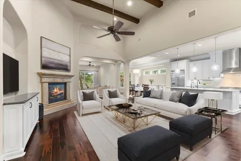 a living room with furniture fireplace and flat screen tv