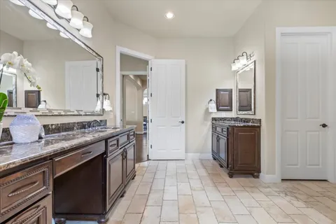 a kitchen with stainless steel appliances granite countertop a sink and a stove