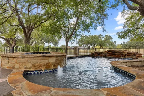 a view of a swimming pool with a patio