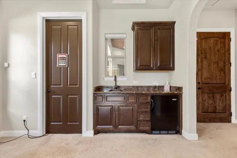 a bathroom with a sink vanity and mirror