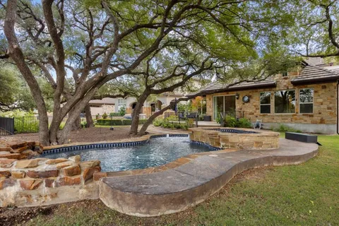 a view of a house with swimming pool