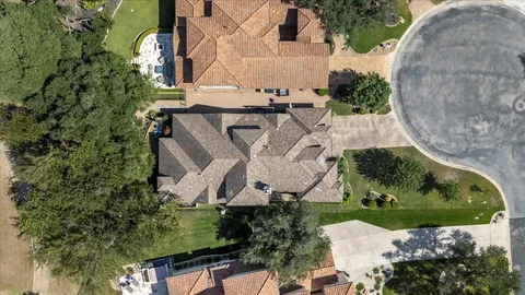 an aerial view of a house with outdoor space
