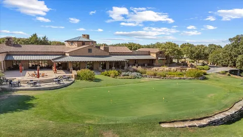 a view of a lake with a house in the background