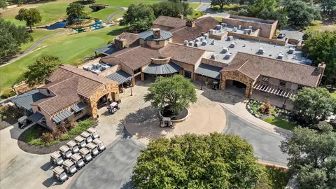 an aerial view of a house with outdoor space