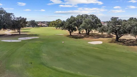 an aerial view of a residential houses with outdoor space