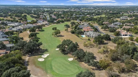 an aerial view of a house with a yard and garden