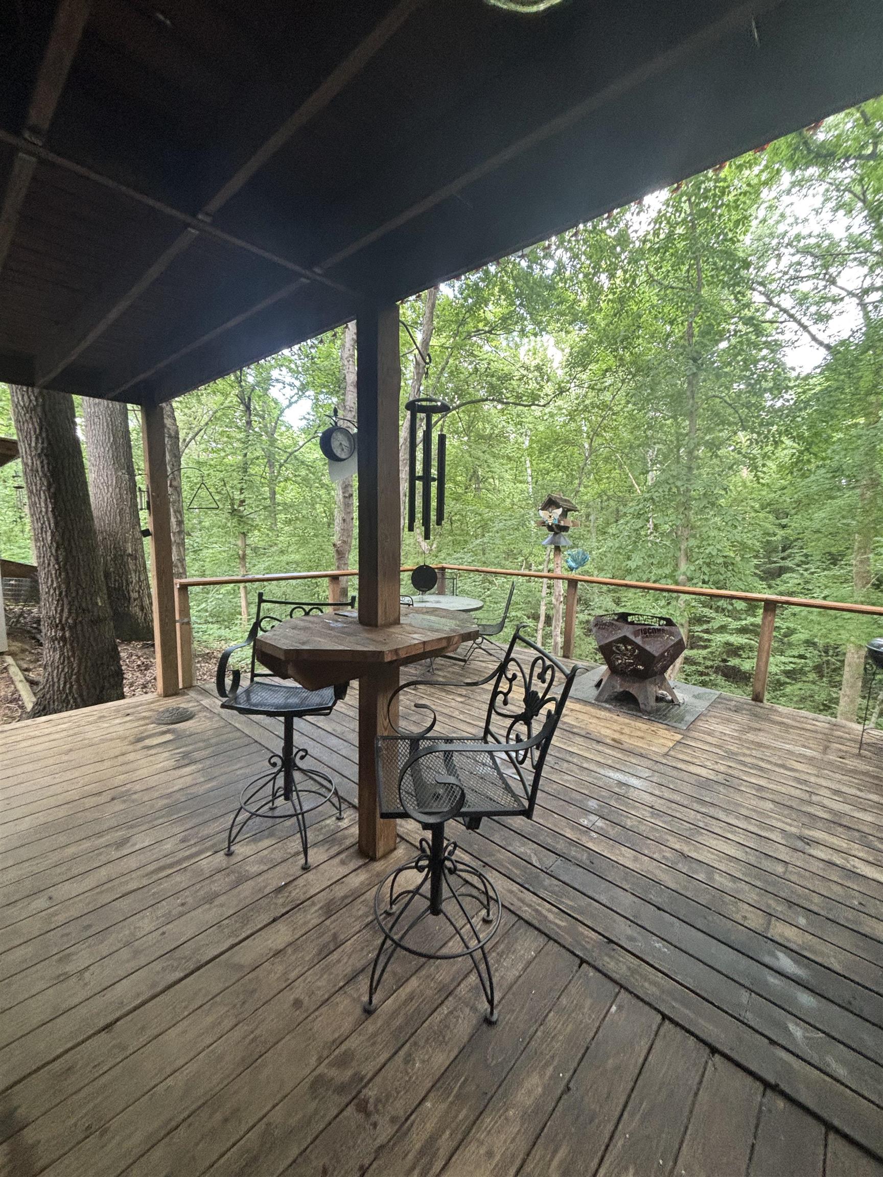 7462 Campground Road Drummonds, TN 38023 - Photo 2 of 31 Expansive wooden deck featuring sturdy wood railing and a covered overhead structure