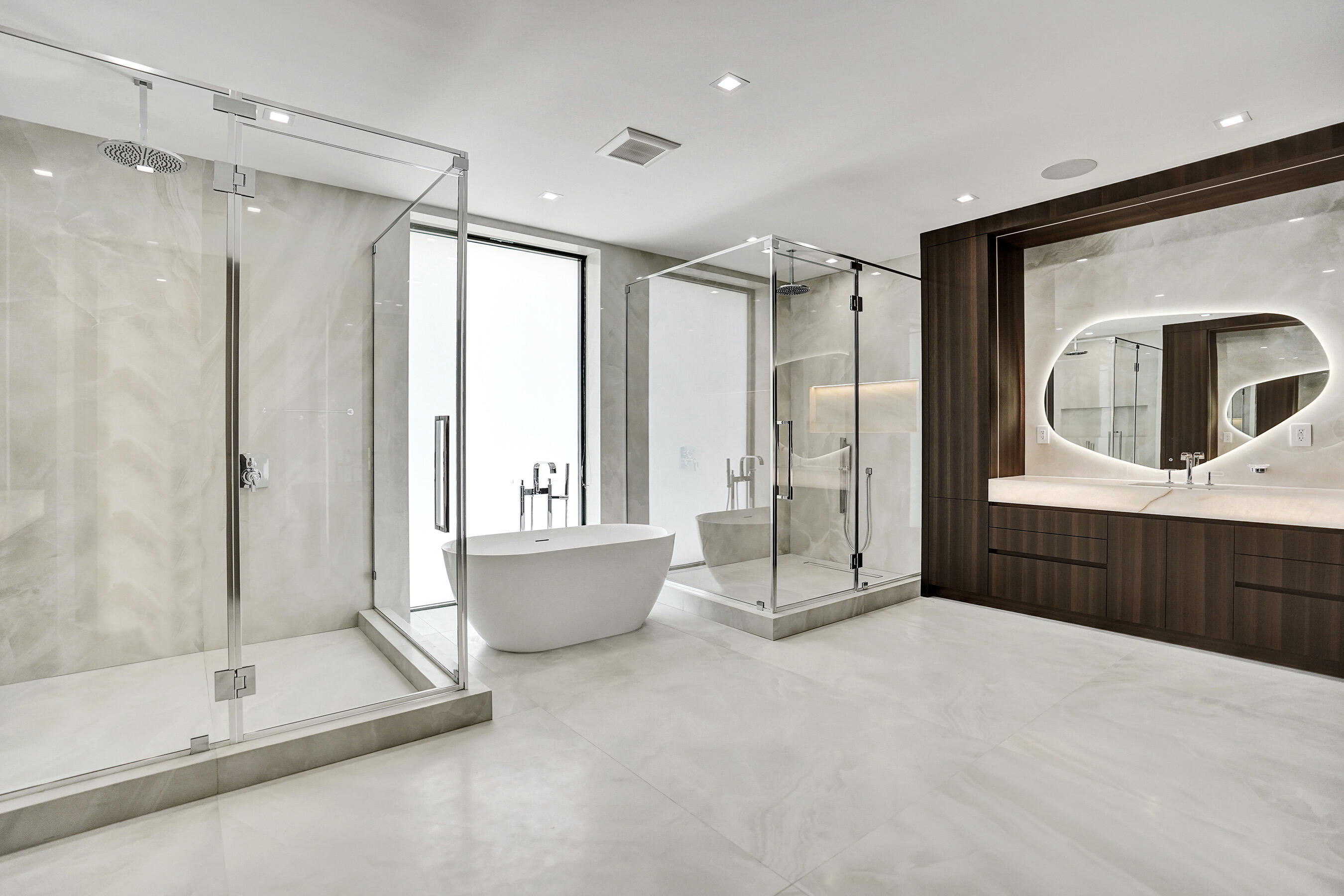 365 Northeast 3rd Street Boca Raton, FL 33432 - Photo 17 of 41 a spacious bathroom with a tub a mirror and shower