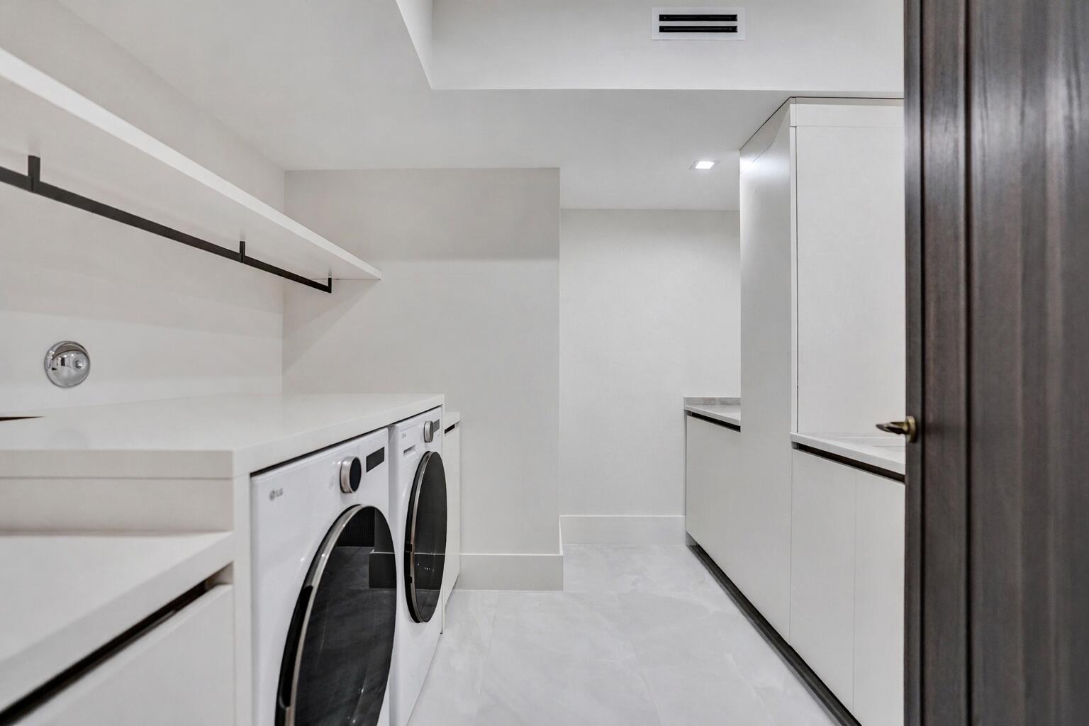 365 Northeast 3rd Street Boca Raton, FL 33432 - Photo 25 of 41 a view of a storage & utility room with washer and dryer