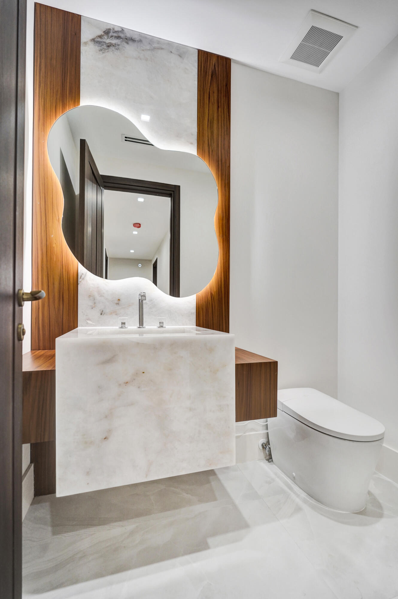 365 Northeast 3rd Street Boca Raton, FL 33432 - Photo 27 of 41 a bathroom with a toilet and a mirror