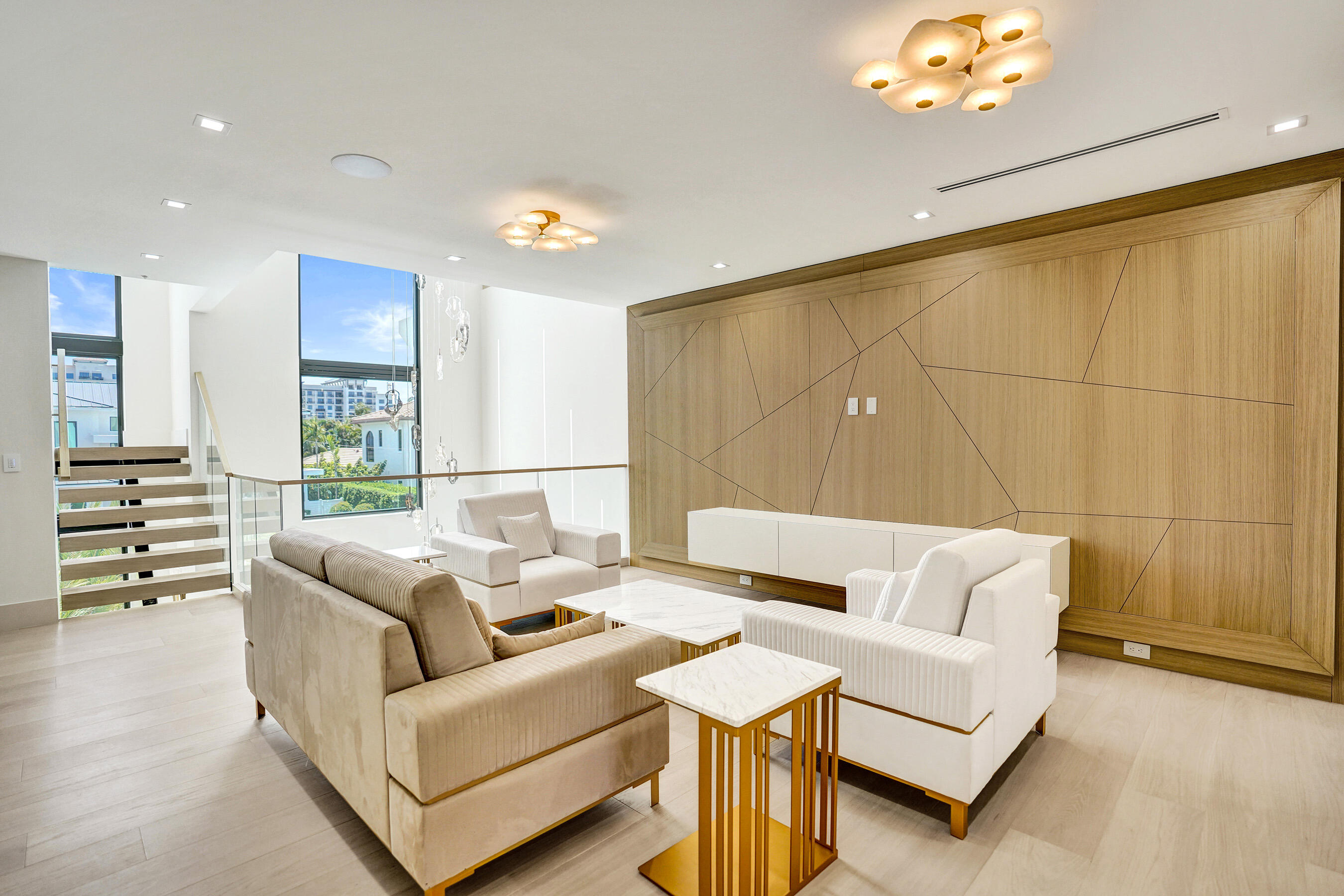 365 Northeast 3rd Street Boca Raton, FL 33432 - Photo 29 of 41 a living room with furniture a lamp and a chandelier