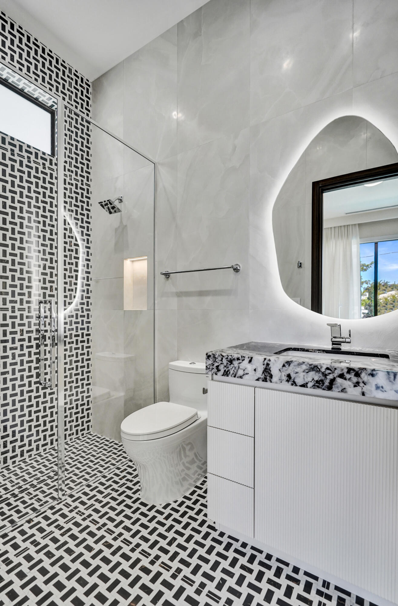 365 Northeast 3rd Street Boca Raton, FL 33432 - Photo 33 of 41 a bathroom with a sink toilet vanity and shower