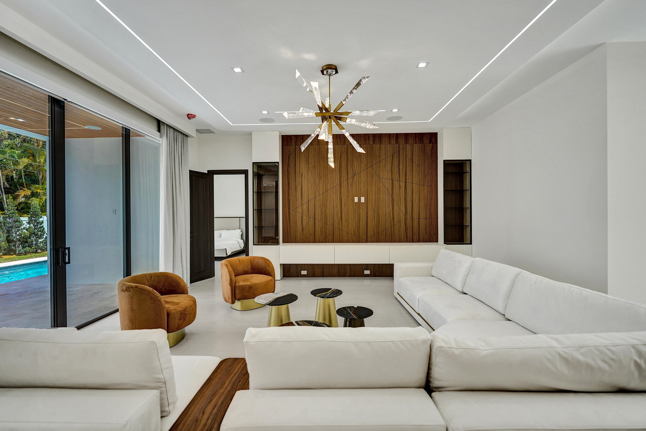 365 Northeast 3rd Street Boca Raton, FL 33432 - Photo 7 of 41 a living room with furniture ceiling fan and a large window