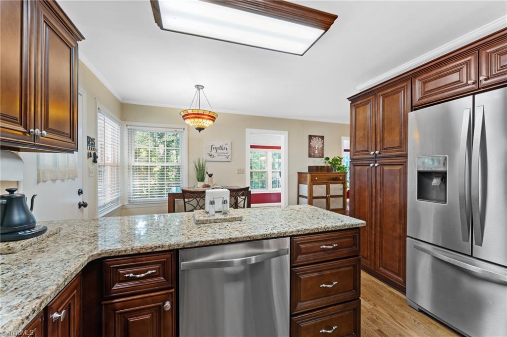 1053 Cantering Road High Point, NC 27262 - Photo 22 of 46 Kitchen space shows to the eat in dining space