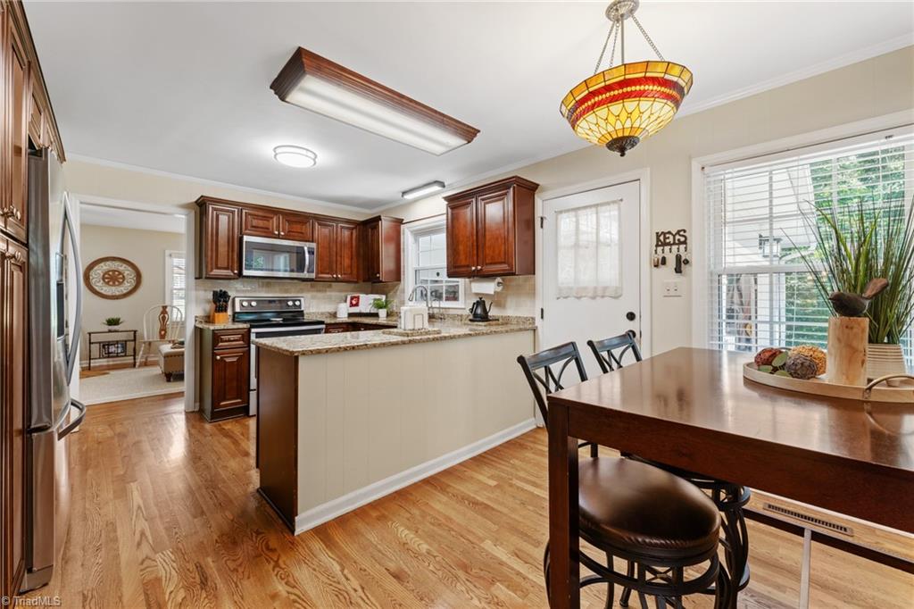 1053 Cantering Road High Point, NC 27262 - Photo 24 of 46 Great eat in space and large window with so much streaming light!