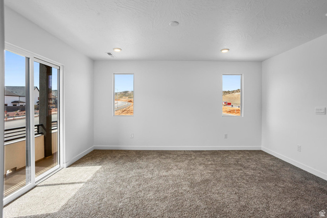 2194 Wolverine Way, Unit 2531 Washington, UT 84780 - Photo 31 of 52 Spacious room featuring neutral carpet flooring, white walls, and recessed lighting