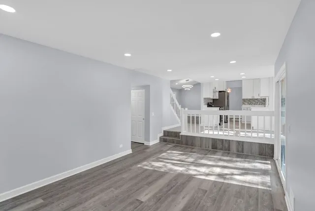 a view of kitchen with wooden floor