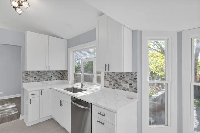 a kitchen with a sink and cabinets