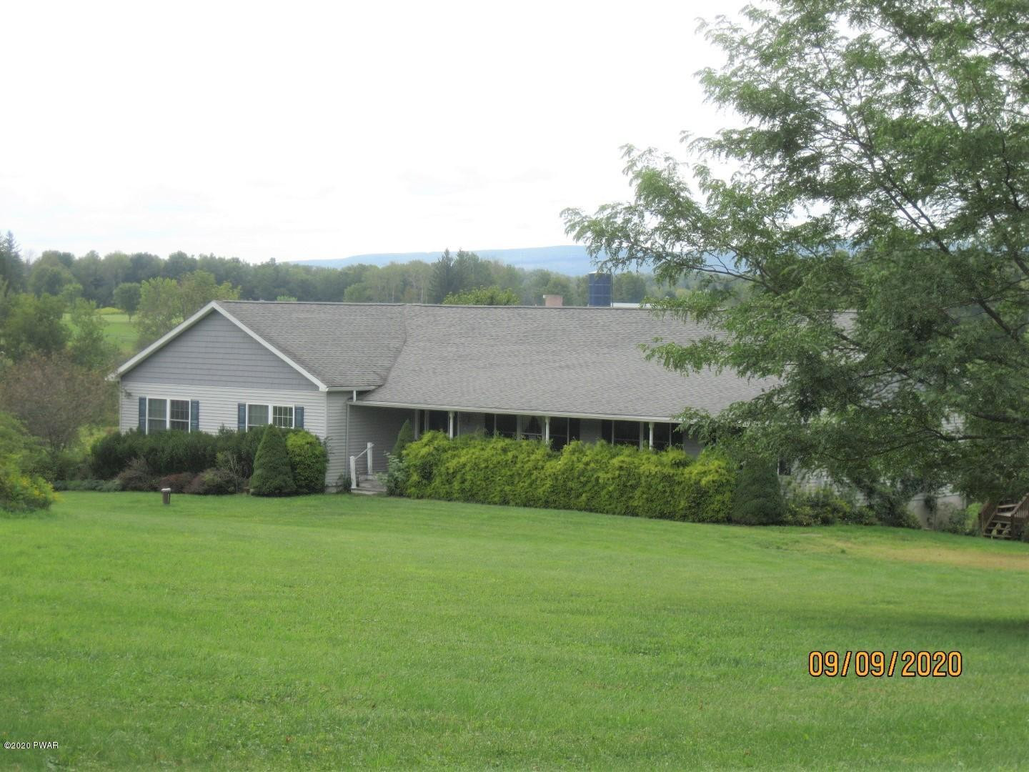 271 North Baker Road Waymart, PA 18472 - Photo 3 of 25 a front view of a house with a yard