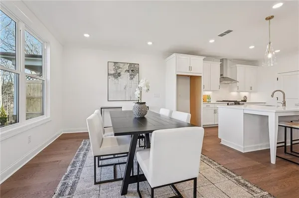a view of a dining room with furniture and a window