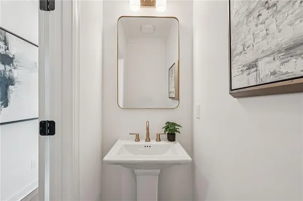 a spacious bedroom with a bed a couch and a window