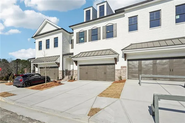 a front view of a building with many windows