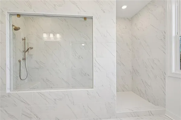 a bathroom with a double vanity sink and a mirror