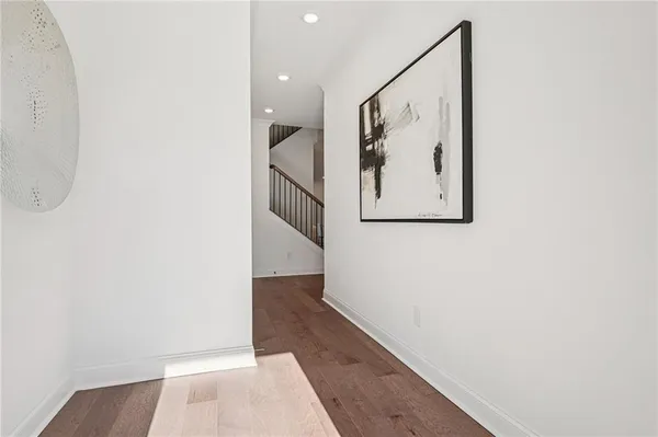 a view of a hallway with paintings on the wall