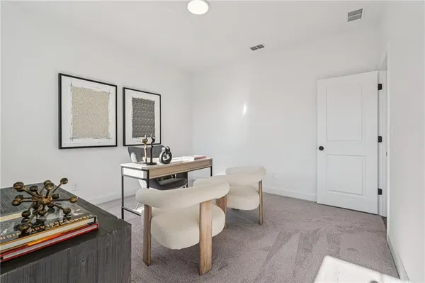 a view of a hallway with a glass door and shower