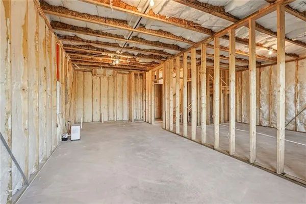 a balcony with furniture and wooden floor