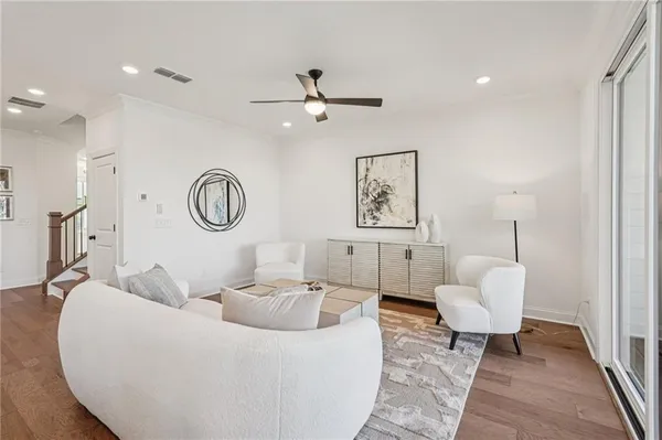 a living room with furniture and a mirror