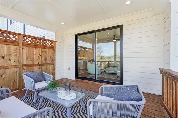 a view of a dining room with furniture wooden floor and a rug
