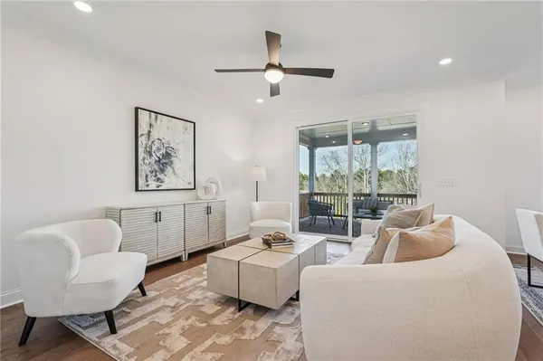 a living room with furniture and a large window