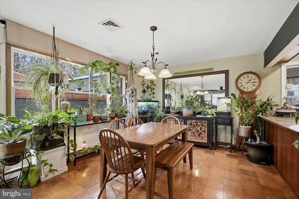 a kitchen with stainless steel appliances granite countertop a refrigerator a stove a sink and dishwasher