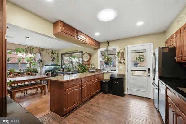 a spacious bedroom with a bed and a chandelier