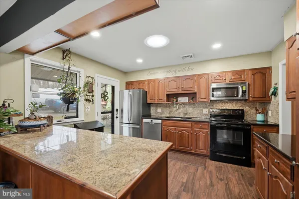 a bed room with furniture and a flat screen tv