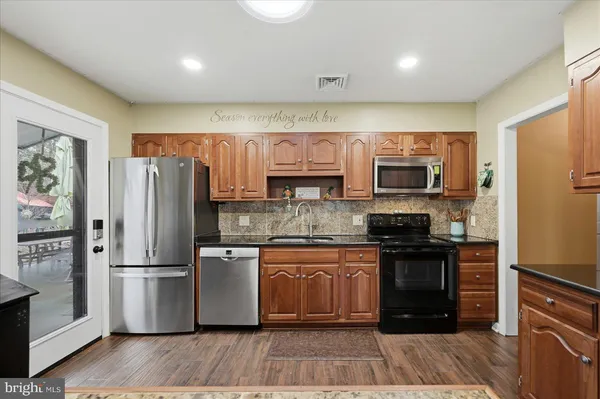 a bedroom with a bed window and a television