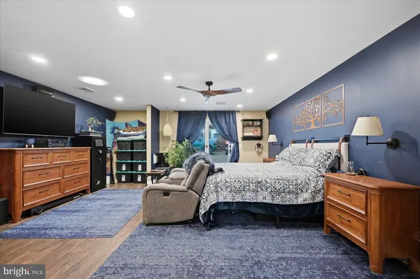 a view of kitchen with sink and refrigerator