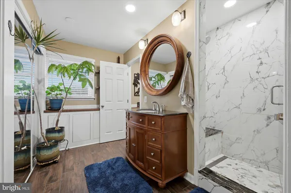 a view of a lake with outdoor seating and city view