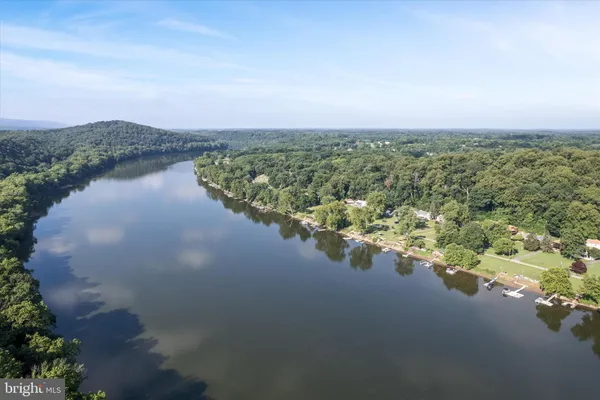 an aerial view of a house with a lake view