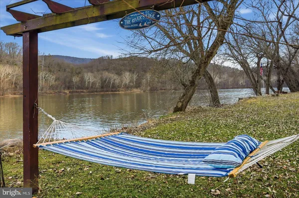 a view of a wooden deck with a bench