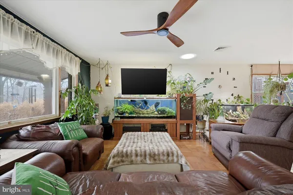 a kitchen with stainless steel appliances granite countertop a refrigerator a sink and a stove