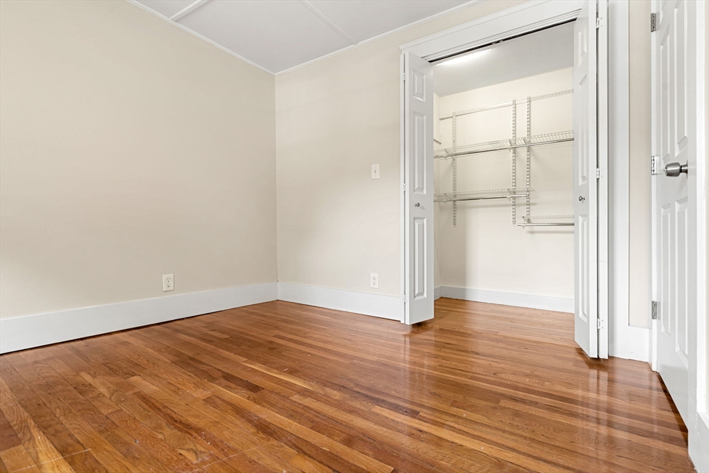 12 Chestnut Street Danvers, MA 01923 - Photo 27 of 37 a view of an empty room with wooden floor and a window
