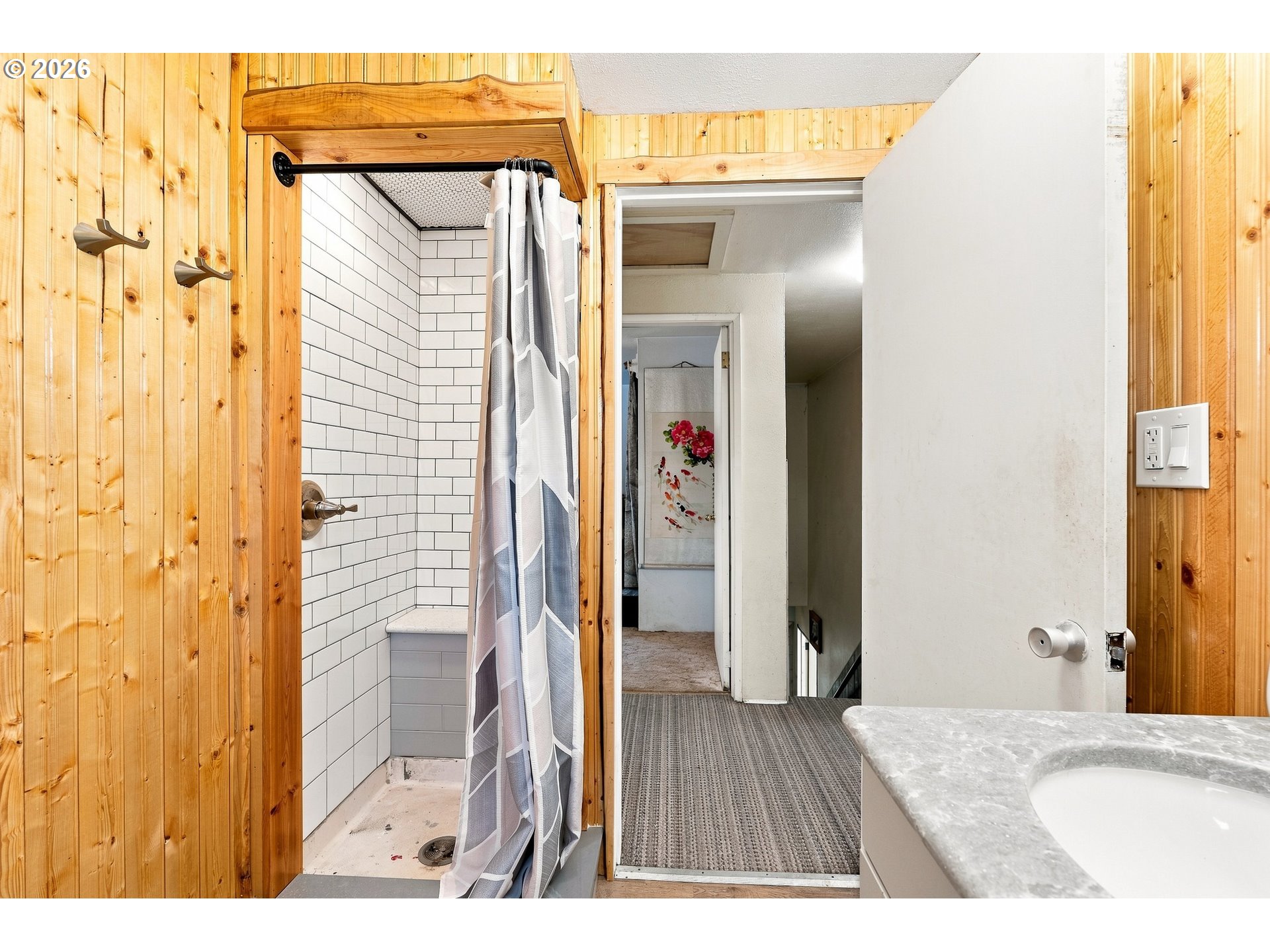 68763 Wasser Road Rainier, OR 97048 - Photo 19 of 42 a bathroom with a glass shower door